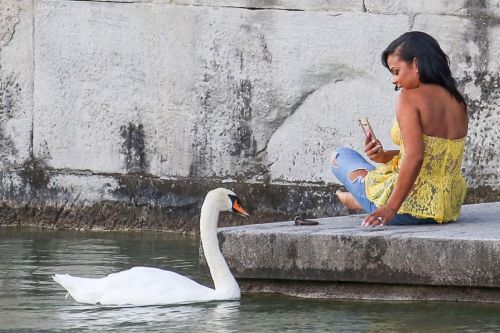 Christina Milian comes head to head with a swan in Zurich