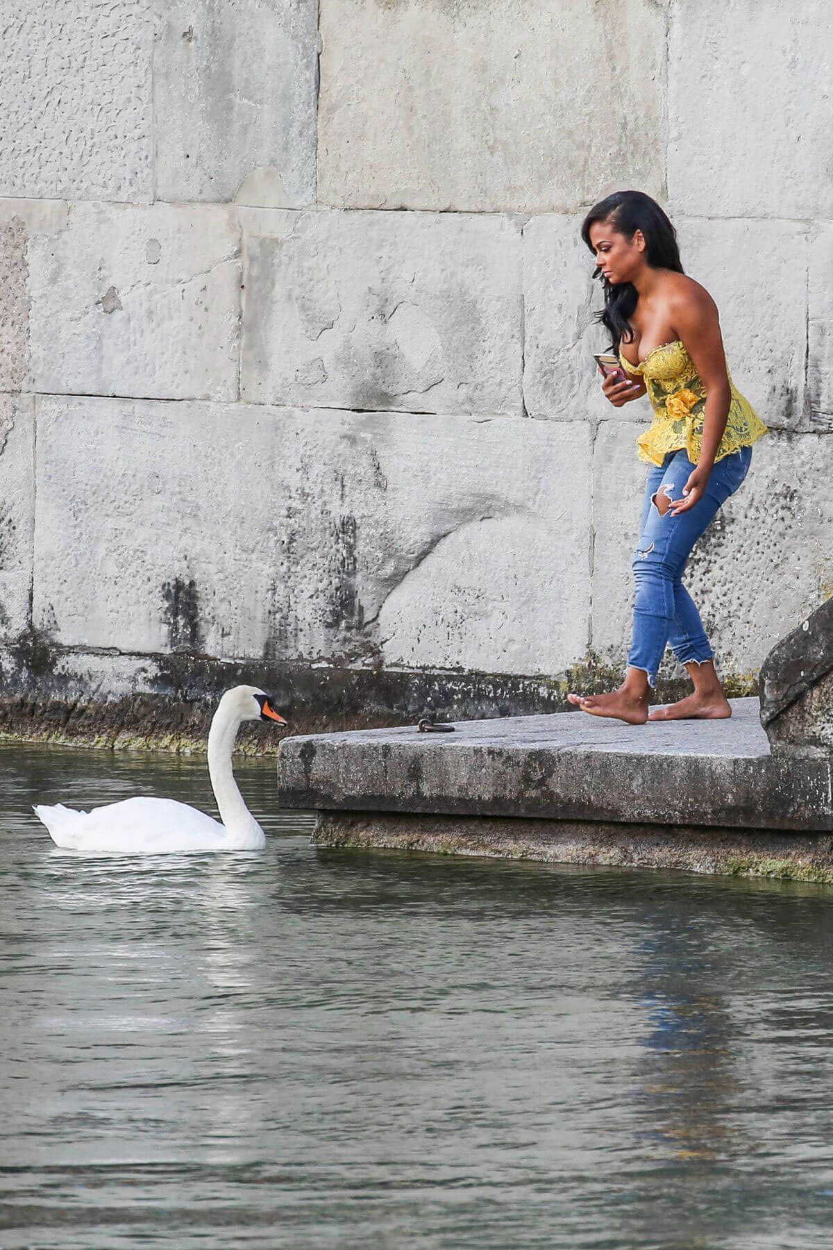 Christina Milian comes head to head with a swan in Zurich 2