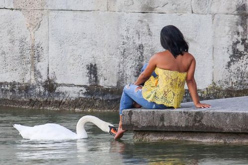 Christina Milian comes head to head with a swan in Zurich