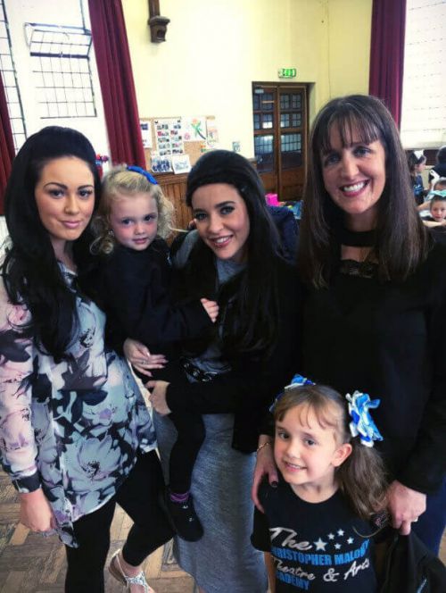 Stephanie Davis shows off her baby bump on a school