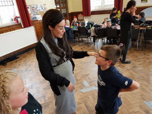 Stephanie Davis shows off her baby bump on a school 9