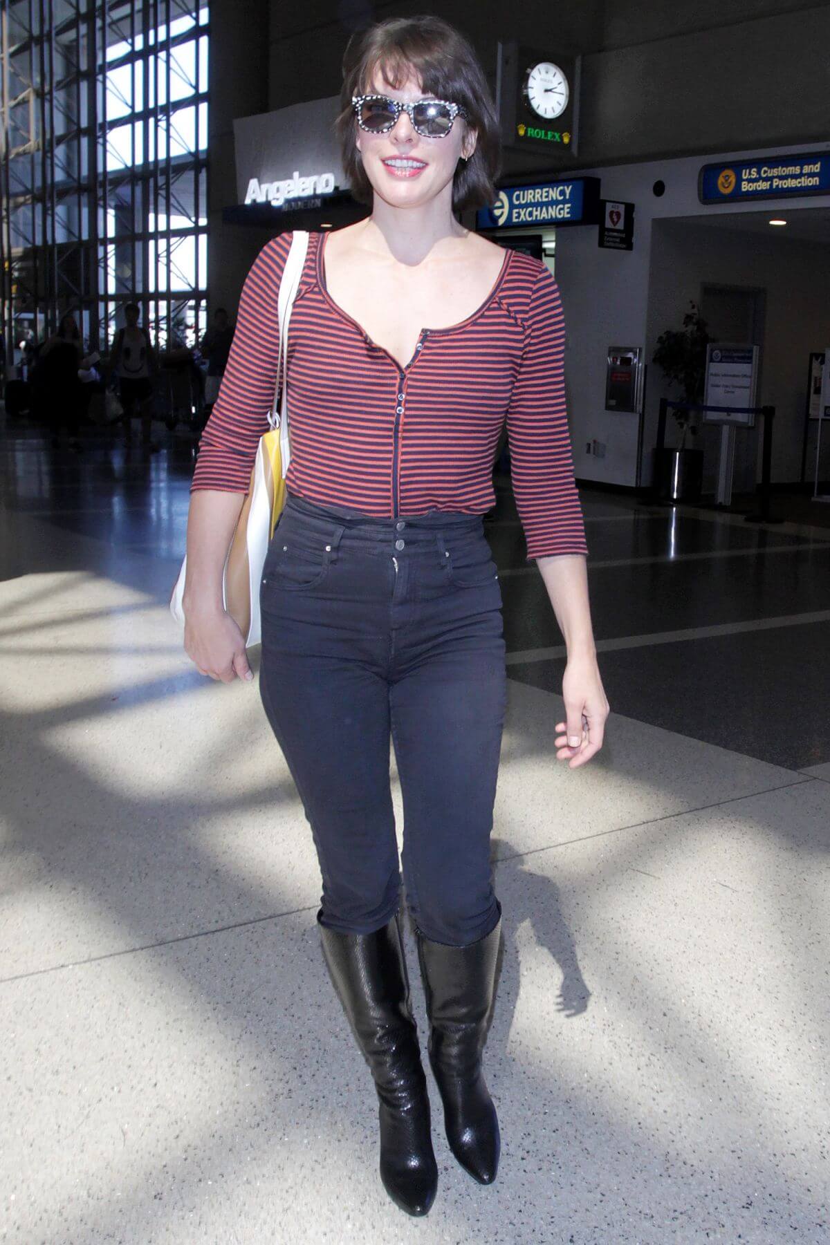 Milla Jovovich Stills at Los Angeles International Airport 5