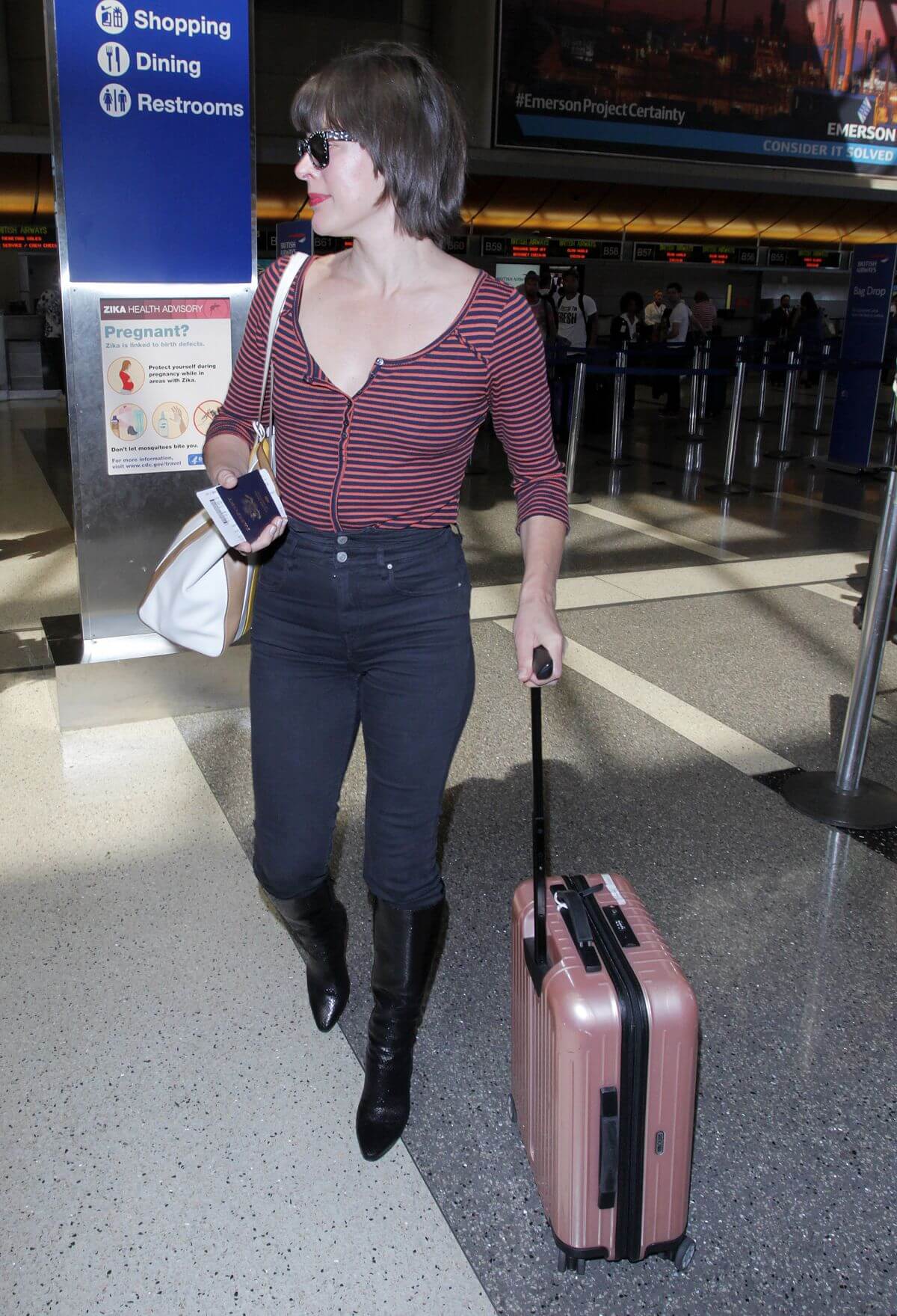 Milla Jovovich Stills at Los Angeles International Airport 10