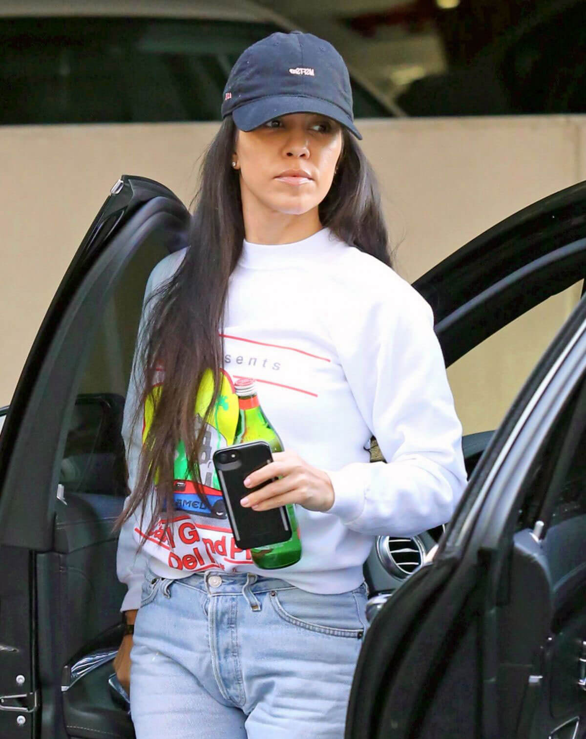Kourtney Kardashian Stills in Ripped Jeans Out in Woodland Hills