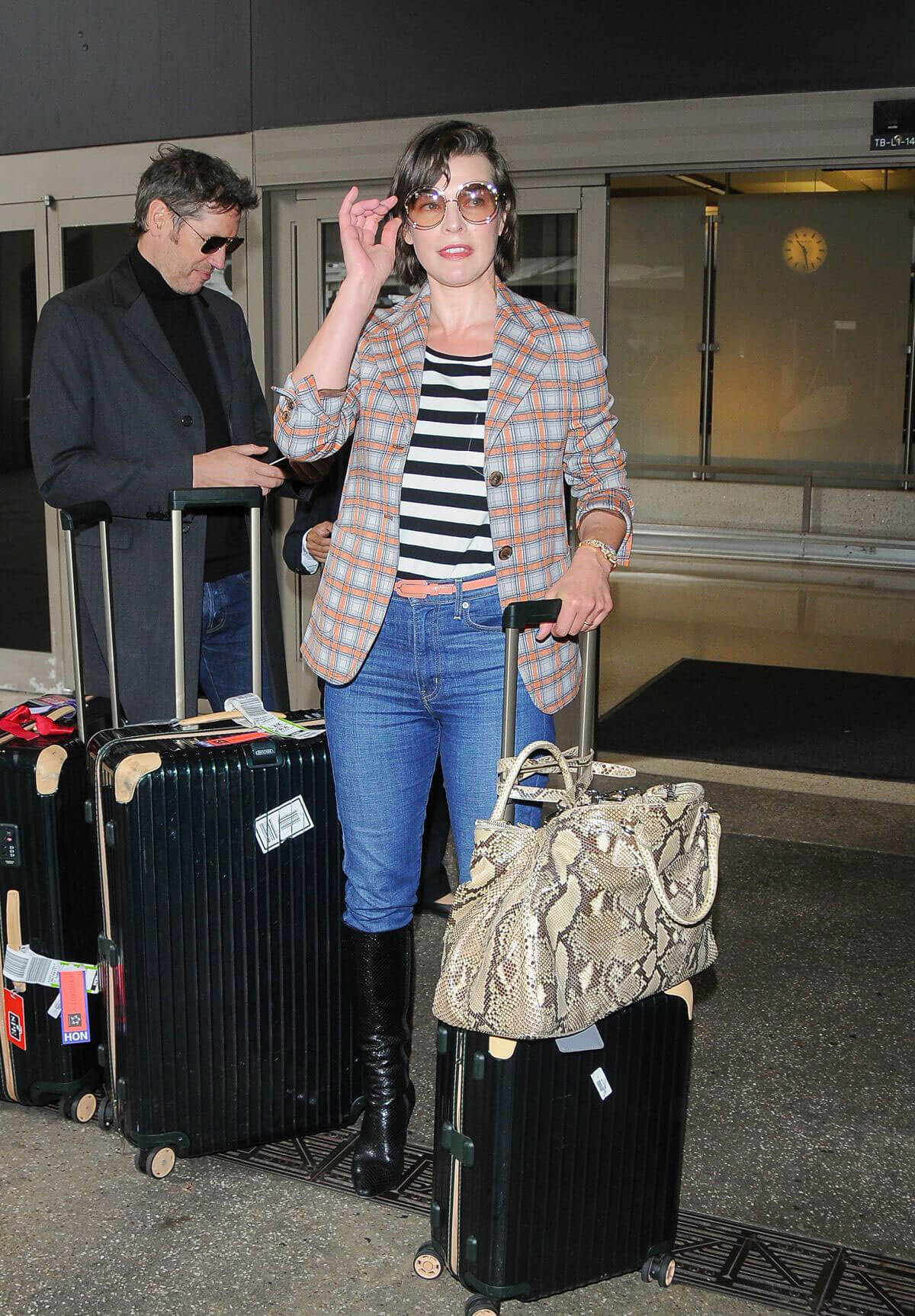 Milla Jovovich at Los Angeles International Airport 6