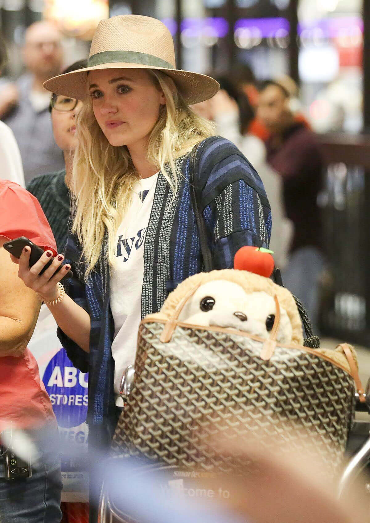AJ Michalka wears Hat Stills at Los Angeles International Airport