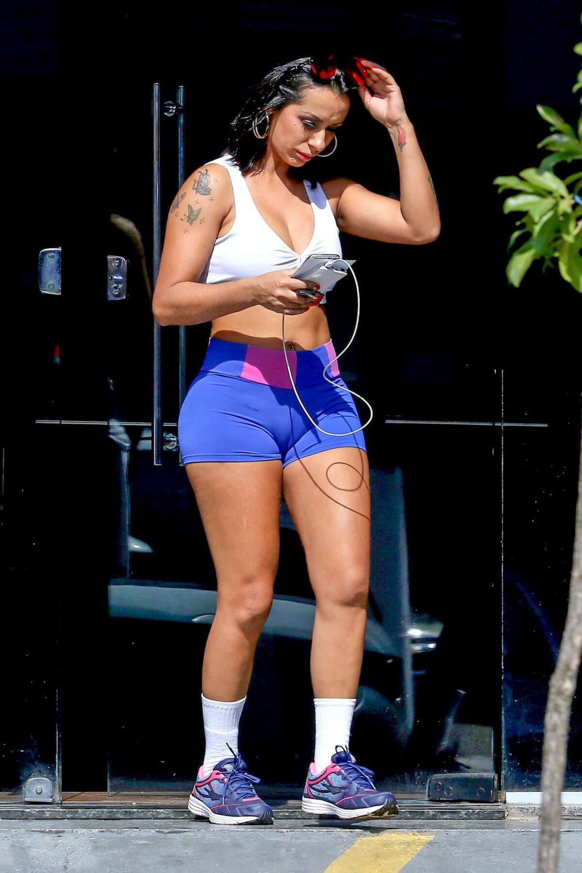 Deborah Dunhill wears blue Shorts Out in Sao Paulo
