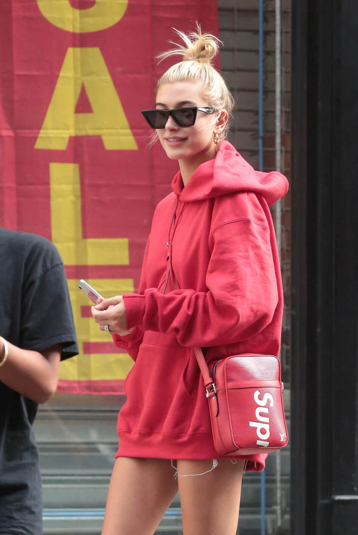 Hailey Baldwin in Oversized Red Hoodie Out in New York
