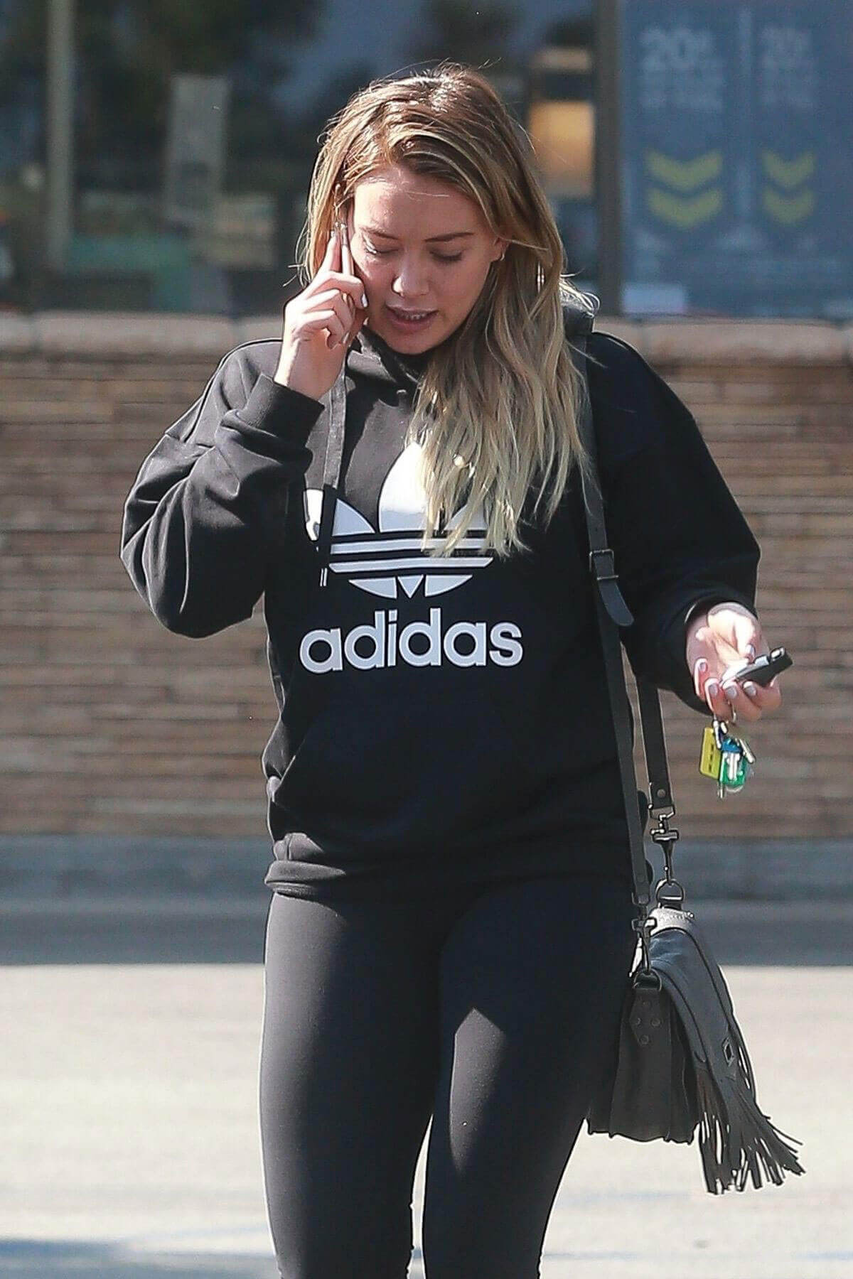 Hilary Duff wears Adidas Sweater Leaves a Grocery Store in Studio City