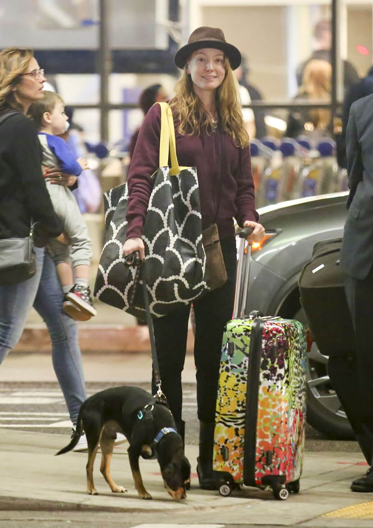 Alicia Witt with her Dog Stills at LAX Airport in Los Angeles