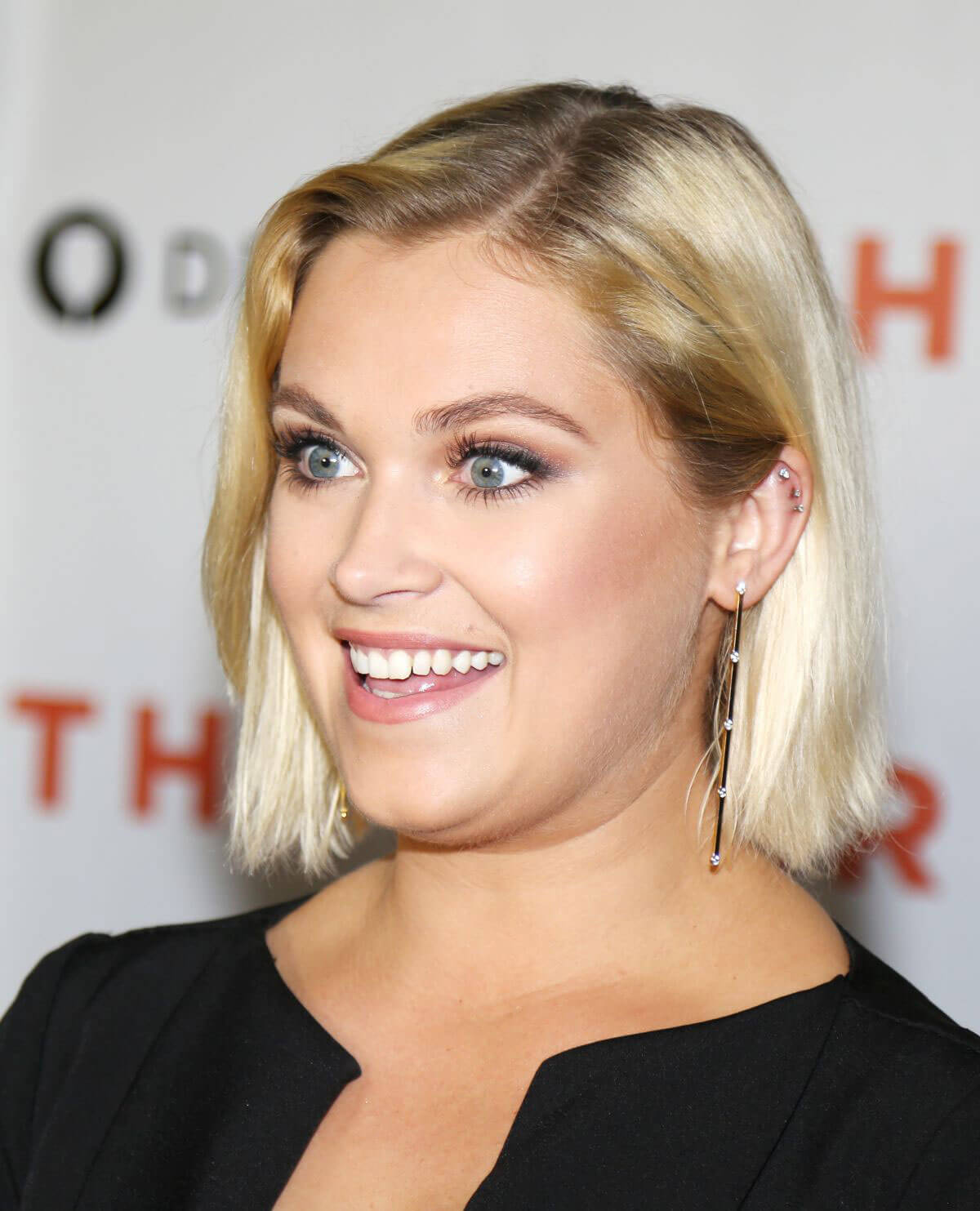 Eliza Taylor wears Black Short Dres at Thumper Premiere in Los Angeles