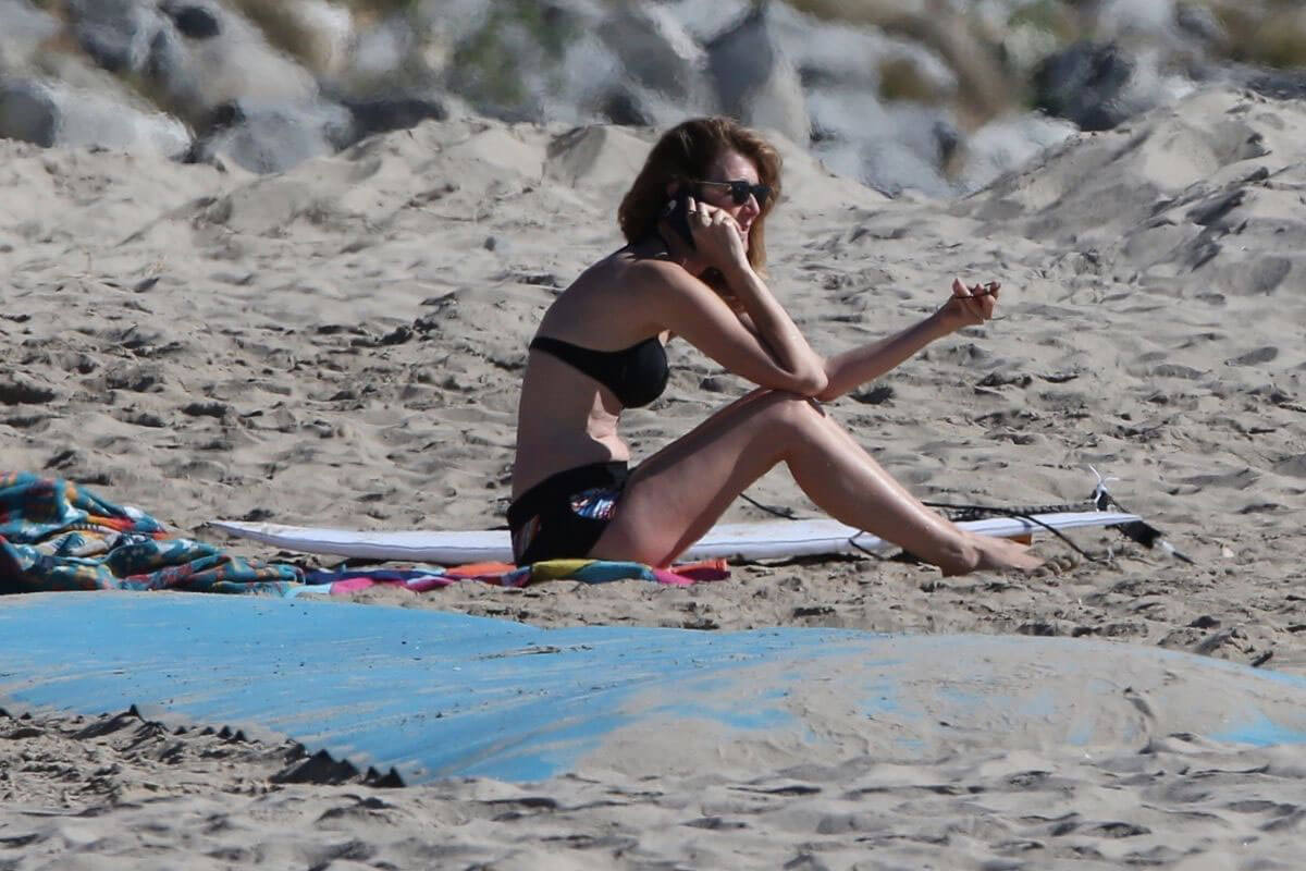 Laura Dern Stills in Bikini Top and Sporty Shorts at a Beach in Malibu