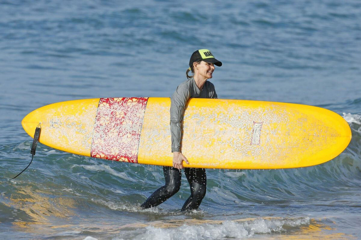 Helen Hunt Stills in Bikini Top Surfing in Hawaii 2017/12/19
