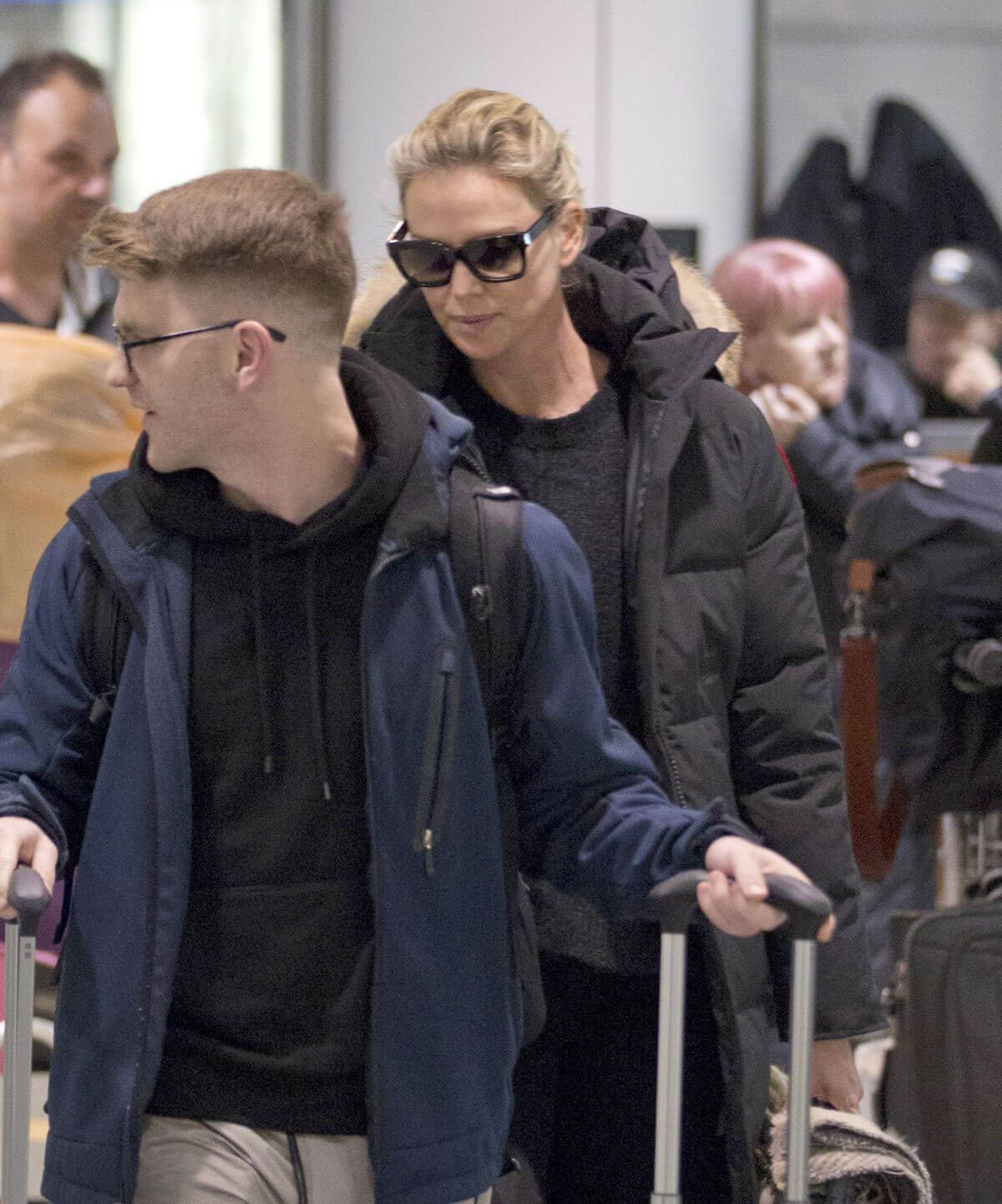 Charlize Theron Stills Arrives at Airport in Montreal 2018/01/11