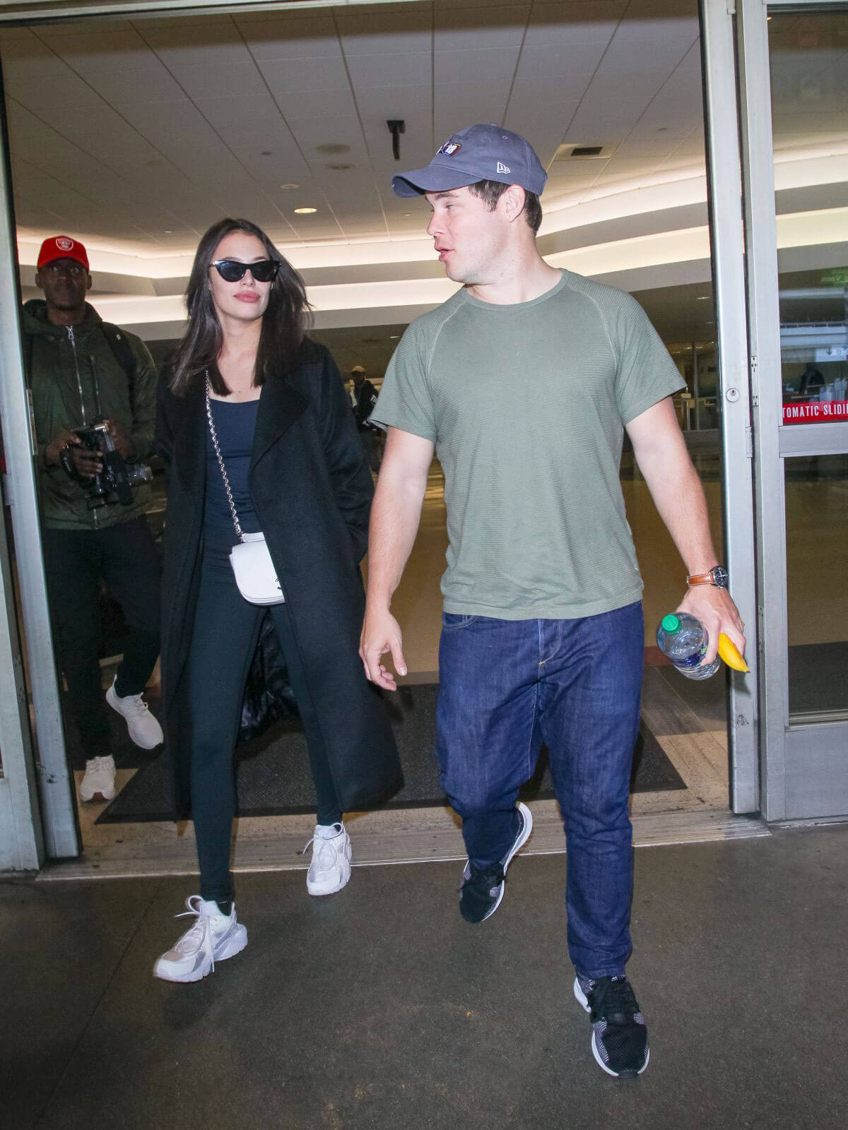 Chloe Bridges and Adam Devine Stills at LAX Airport in Los Angeles 2018/04/20