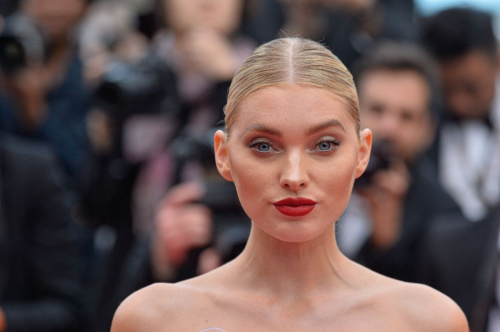 Elsa Hosk exudes the model glamour in plunging chiffon gown at the 