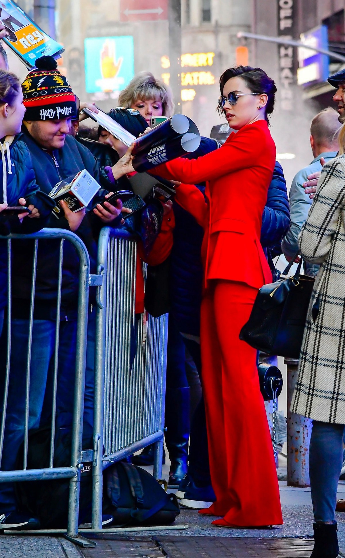 Daisy Ridley in red outfit arrives Good Morning America in New York City 2019/11/26