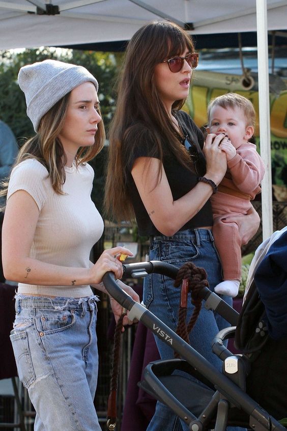 Dakota Johnson around farmers market with her actress friend Addison Timlin and her daughter Ezer Billie White in Los Angeles