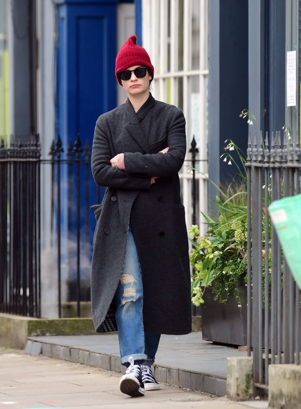 Lily James seen in red hat with long coat out in North London 2020/04/02