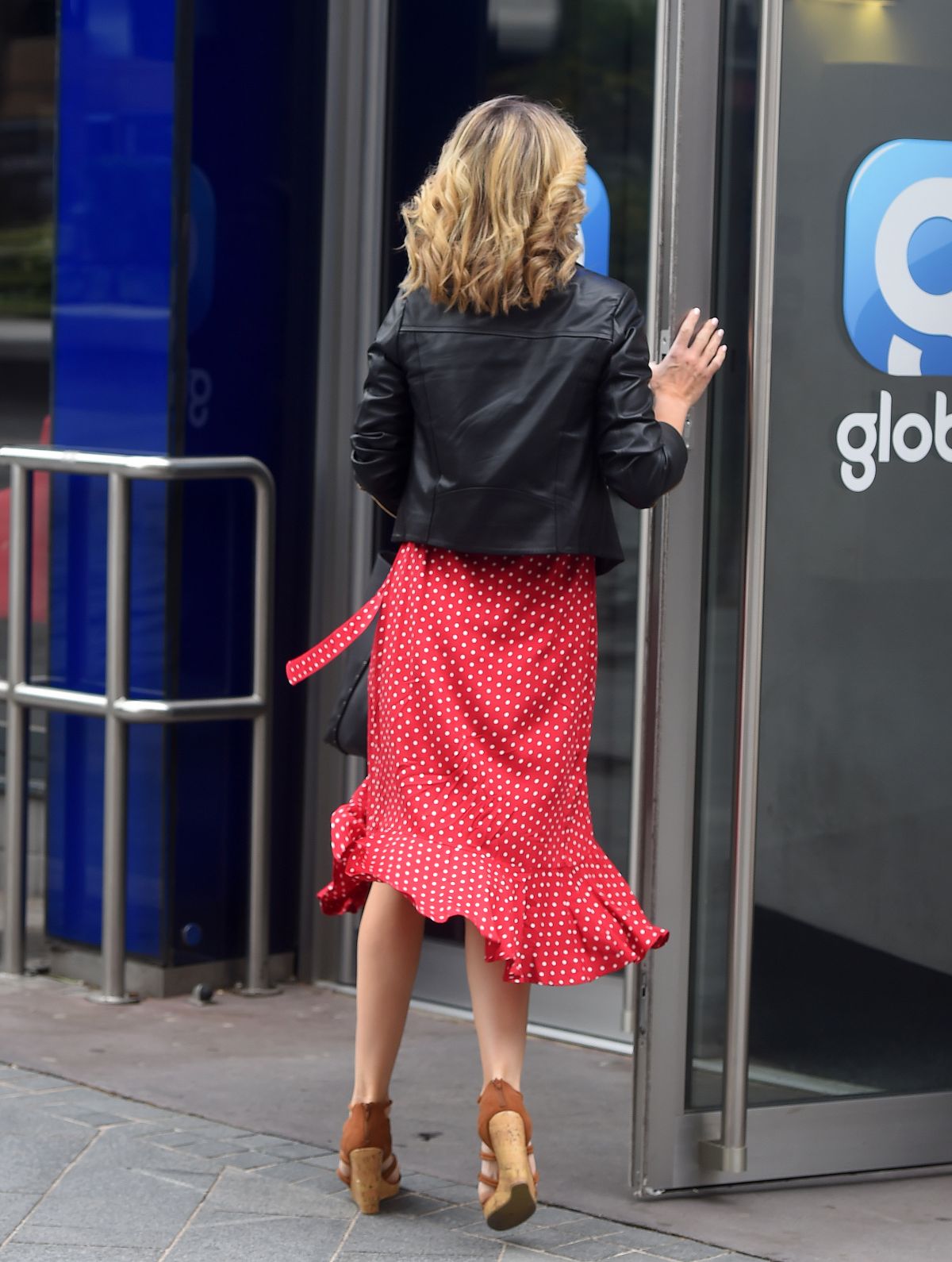 Charlotte Hawkins in a Red Dress and Leather Jacket at Global Radio in London 2020/06/05