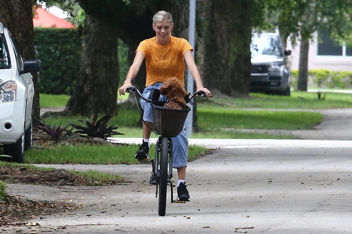 Devon Windsor Out Riding a Bike with Her Dog in Miami 2020/06/06