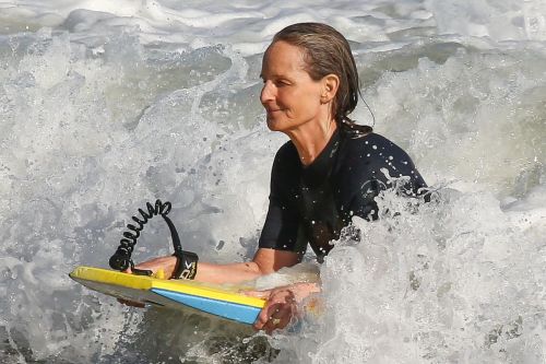 Helen Hunt in Wetsuit Bodyboarding at a Beach in Malibu 2020/06/13 10