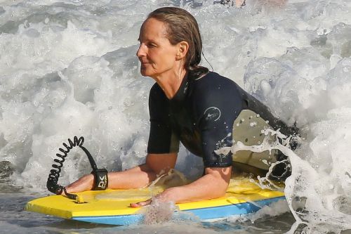 Helen Hunt in Wetsuit Bodyboarding at a Beach in Malibu 2020/06/13 11