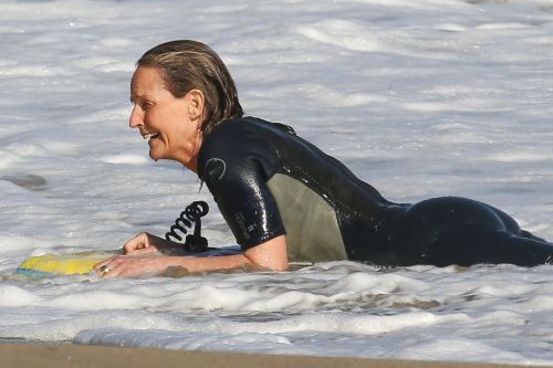 Helen Hunt in Wetsuit Bodyboarding at a Beach in Malibu 2020/06/13 3