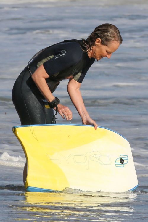 Helen Hunt in Wetsuit Bodyboarding at a Beach in Malibu 2020/06/13 11