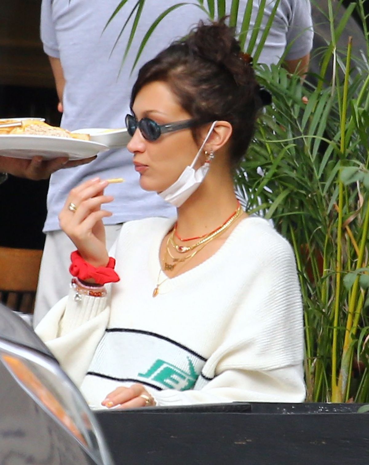 Bella Hadid eating french fries at Three Guys in New York 2020/09/24