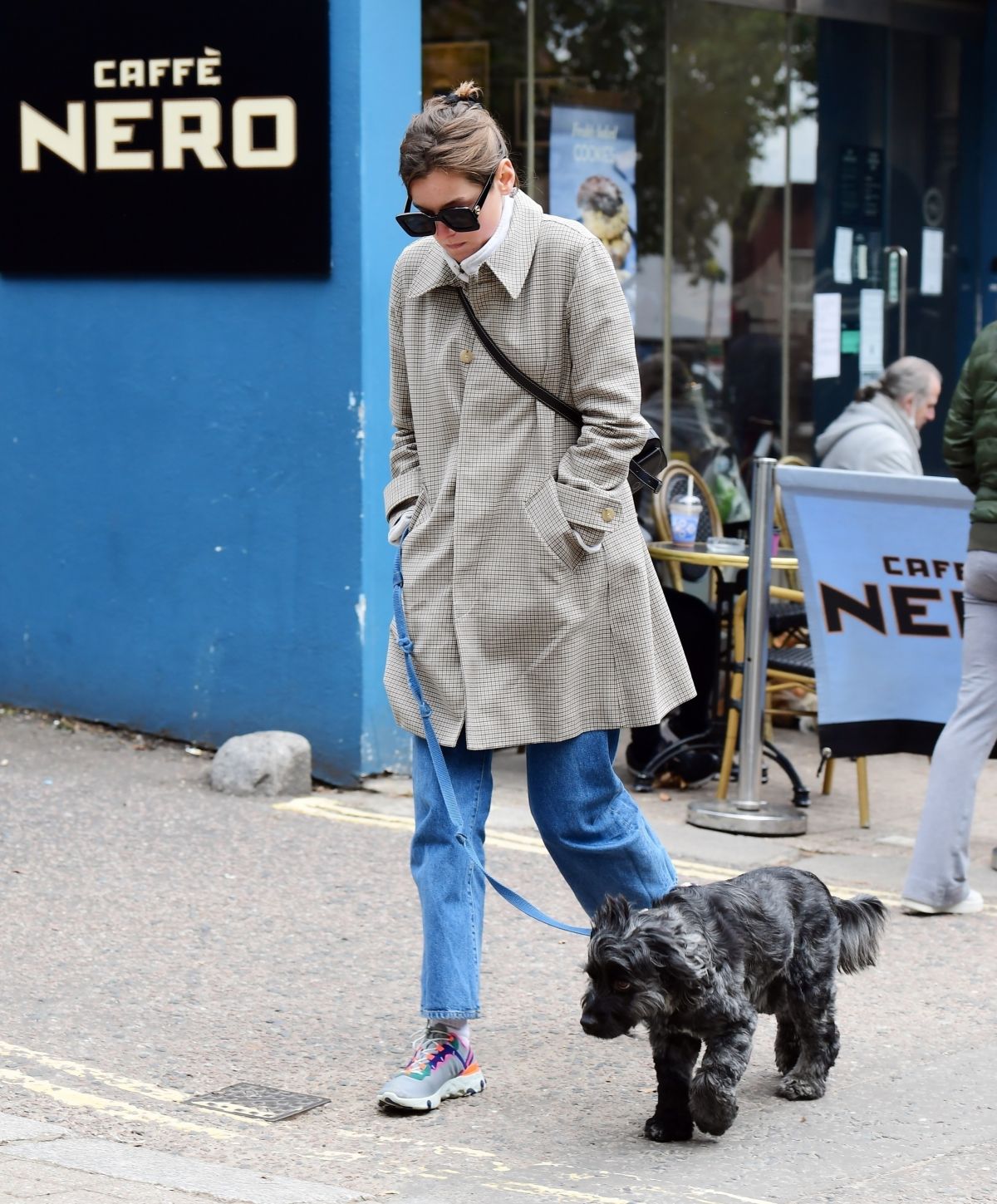 Emma Corrin in Long Coat Out with Her Dog in London 2020/10/18