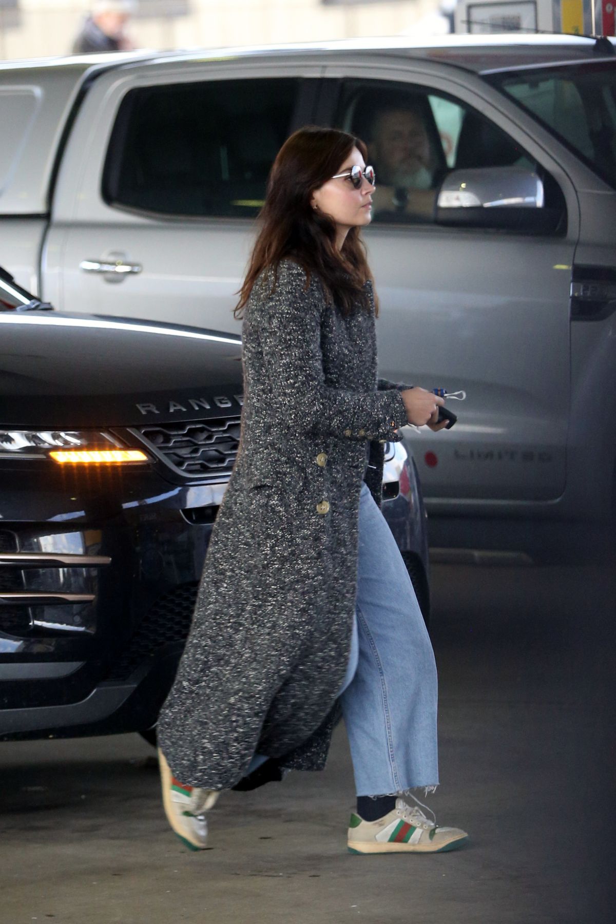 Jenna-Louise Coleman in Long Coat with Jeans at a Gas Station in London 2020/11/15