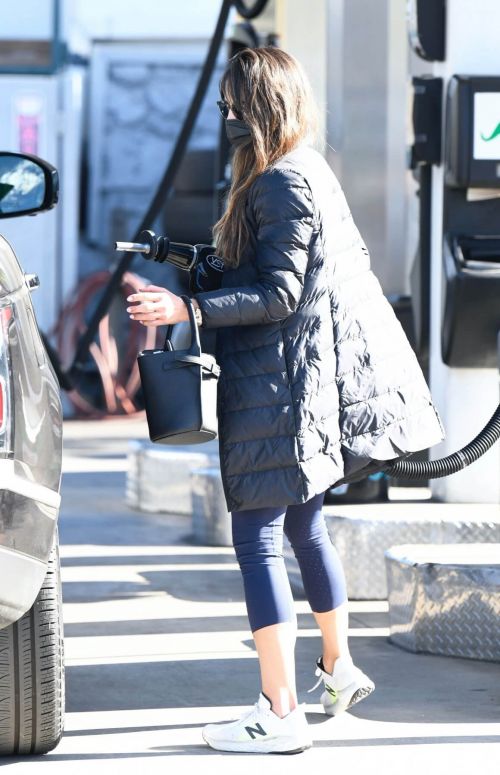 Jordana Brewster seen in Long Puffer Jacket at a Gas Station in Brentwood 12/05/2020 12