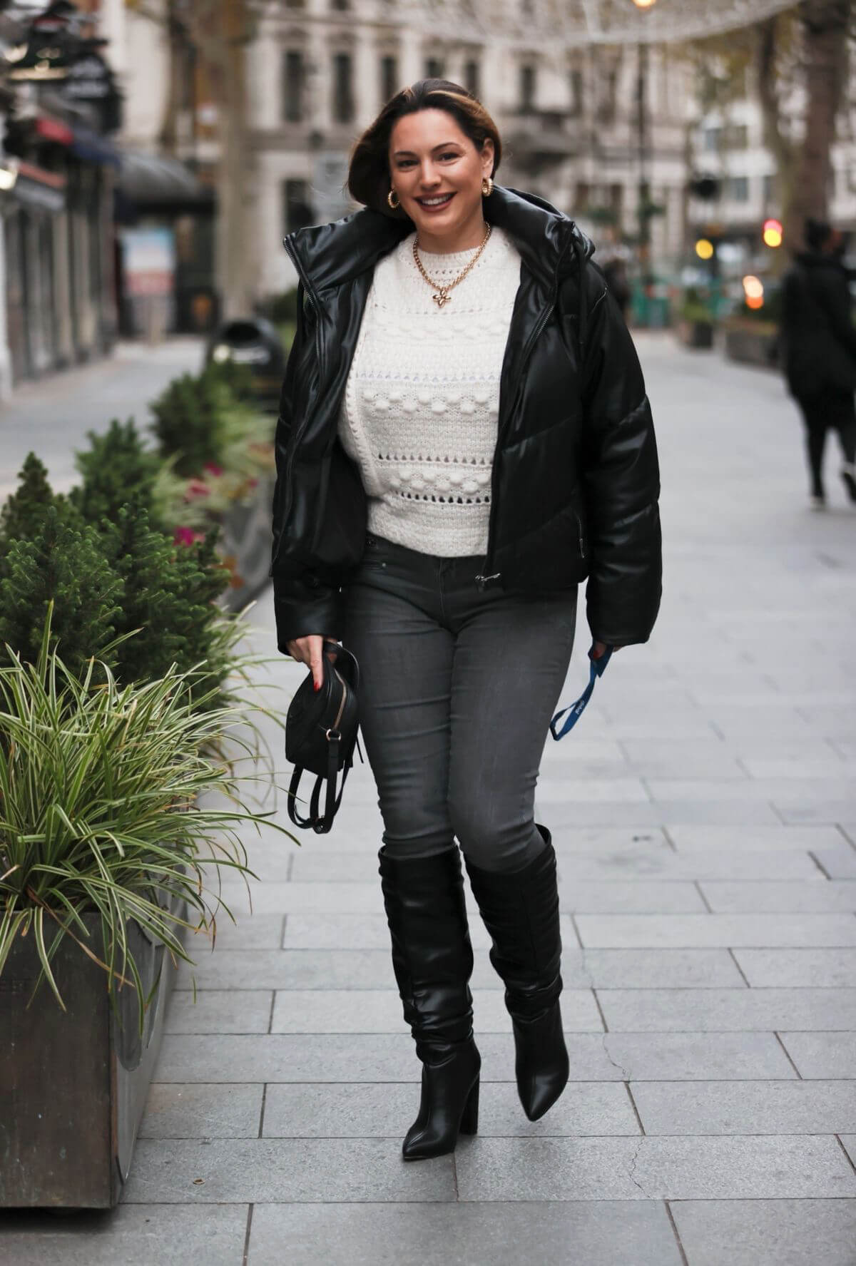 Kelly Brook in Black Puffer Jacket with Long Boots at Heart Radio in London 11/25/2020