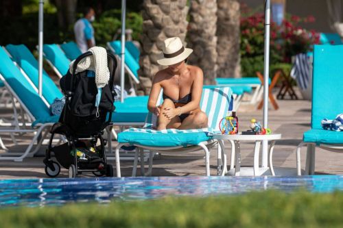 Lauryn Goodman flashes her cleavage in Bikini at a Pool in Dubai 11/26/2020 6