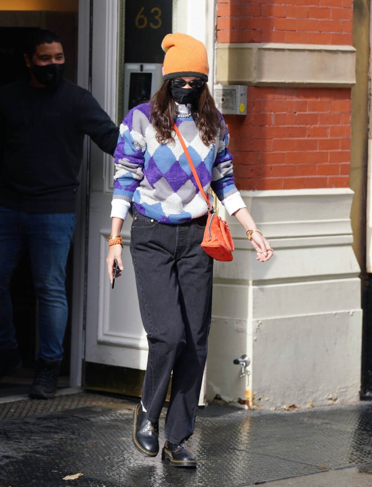 Bella Hadid Leaves Her Apartment in Orange Cap with Check Sweater 02/11/2021