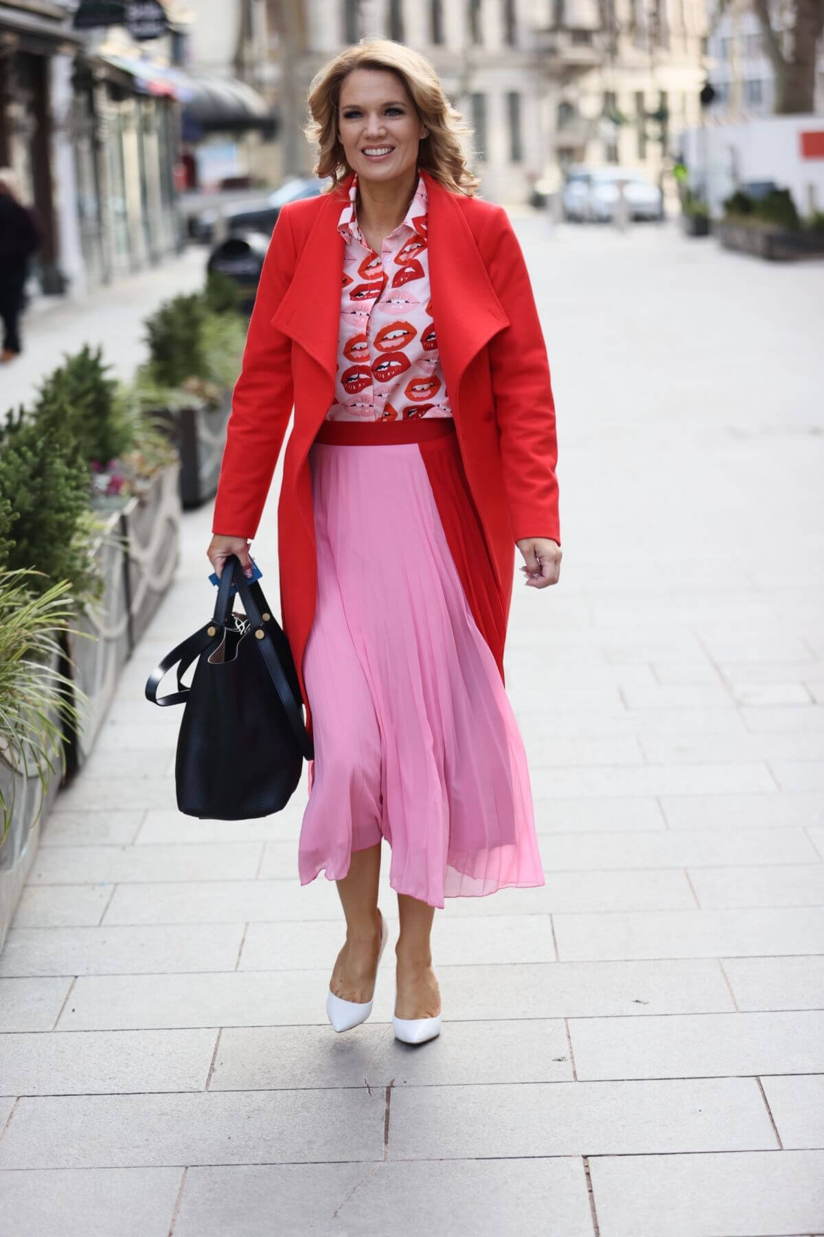 Charlotte Hawkins seen in Red Jacket with Pink Skirt at Global Radio in London 02/12/2021