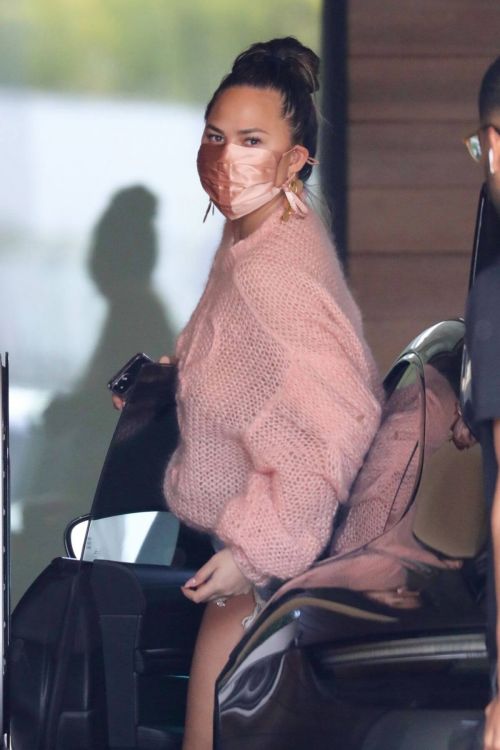 Chrissy Teigen in a Pink Top and Denim Shorts Out in Los Angeles 02/11//2021 2