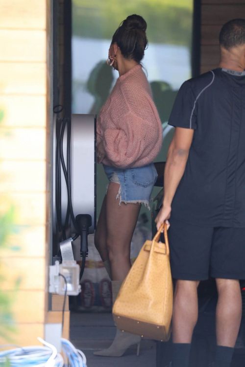 Chrissy Teigen in a Pink Top and Denim Shorts Out in Los Angeles 02/11//2021
