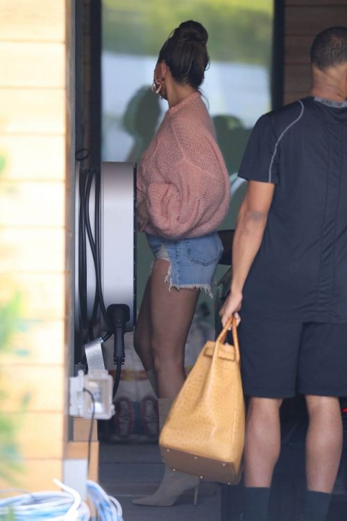 Chrissy Teigen in a Pink Top and Denim Shorts Out in Los Angeles 02/11//2021 3