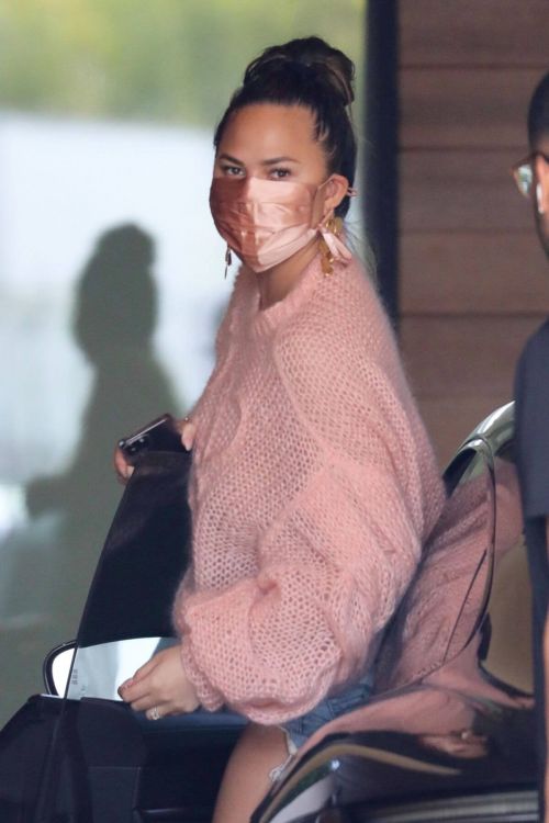 Chrissy Teigen in a Pink Top and Denim Shorts Out in Los Angeles 02/11//2021 4