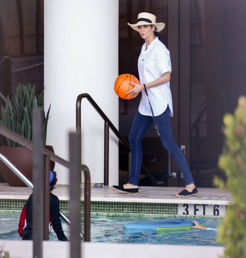 Ivanka Trump in a White Shirt at a Pool in Miami 02/11/2021 3
