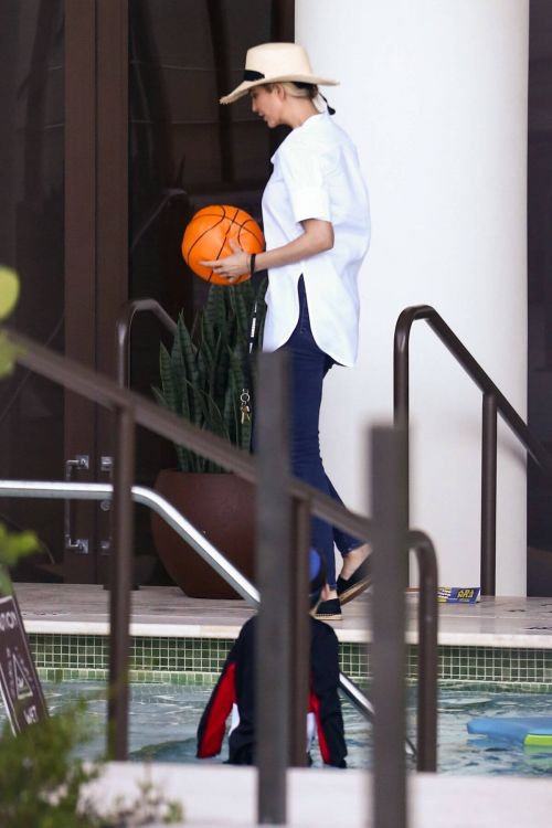Ivanka Trump in a White Shirt at a Pool in Miami 02/11/2021 3
