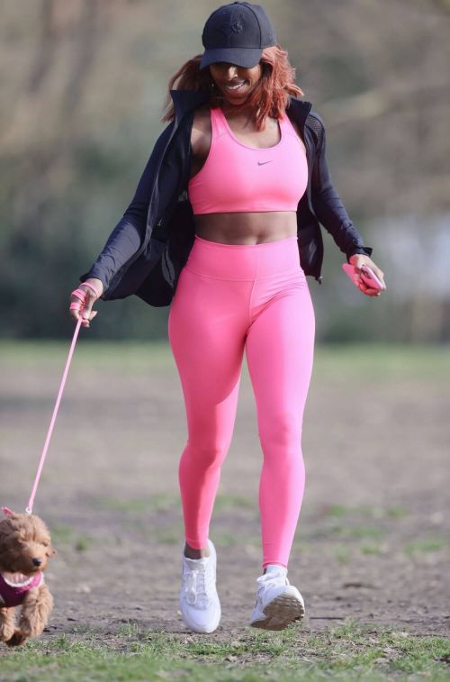 Alexandra Burke Complete Her Sports Look in Bold Pink Sportswear as She Workout at a Park in London 03/10/2021 2