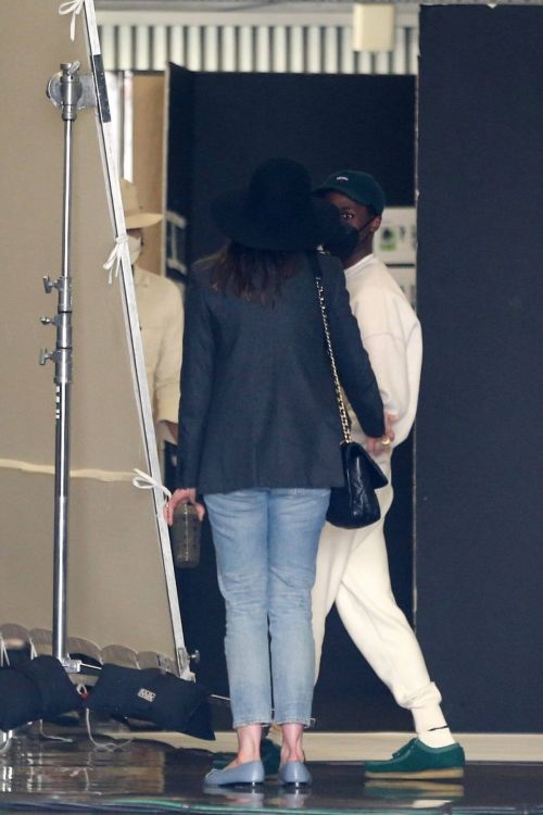 Anne Hathaway wears Black Blazer and Matching Fedora with Blue Denim as She Arrives at Milk Studios in Hollywood 03/12/2021 1