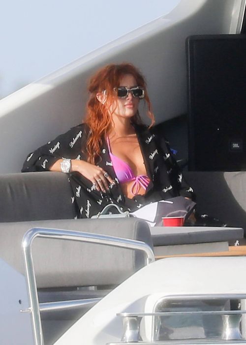 Bella Thorne Flashes Her Cleavage in Violet Bikini as She Enjoys at a Boat in Miami Beach 03/11/2021 1