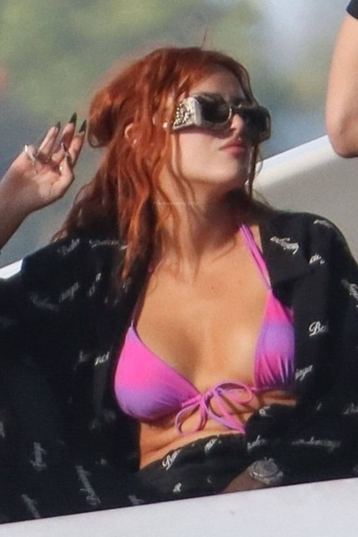 Bella Thorne Flashes Her Cleavage in Violet Bikini as She Enjoys at a Boat in Miami Beach 03/11/2021 4