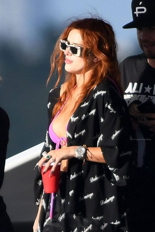 Bella Thorne Flashes Her Cleavage in Violet Bikini as She Enjoys at a Boat in Miami Beach 03/11/2021 5