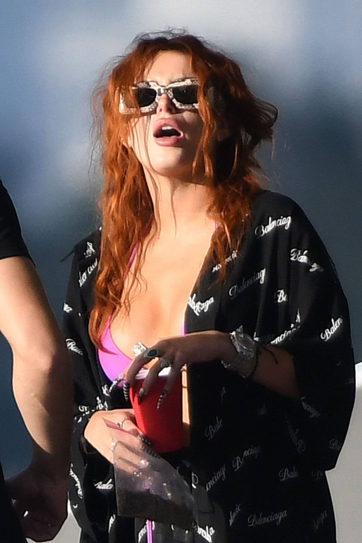 Bella Thorne Flashes Her Cleavage in Violet Bikini as She Enjoys at a Boat in Miami Beach 03/11/2021 2