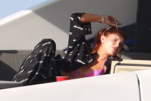 Bella Thorne Flashes Her Cleavage in Violet Bikini as She Enjoys at a Boat in Miami Beach 03/11/2021 8